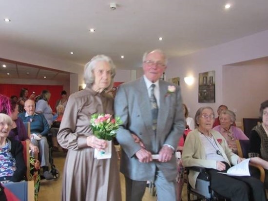 Michael and Audrey at Yew Tree Court, walking up the isle to renew their wedding vows