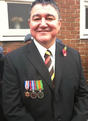 With his dad's war medals
