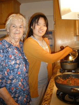 Katherine and her Nana cooking dinner 2014