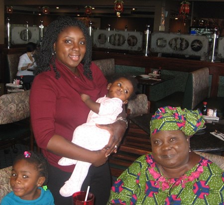 Mom at Restaurant w Bola and Kids