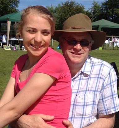 Livvy with her Dad at a summer garden party