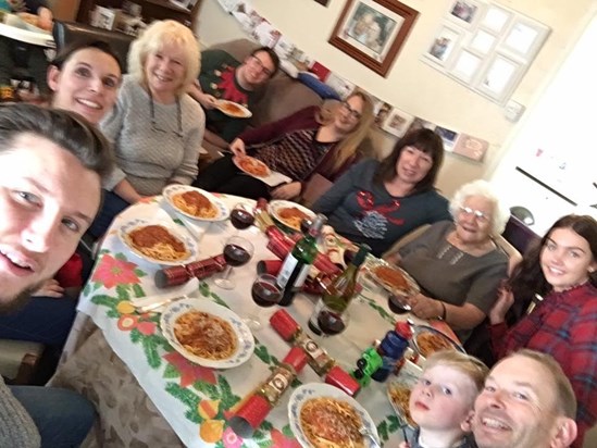 regular Xmas eve tradition family round the table for tuna and anchovies pasta sauce