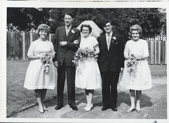 The wedding party with Maggie far left