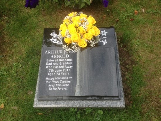 Arthur memorial stone at the cemetary, with yellow roses