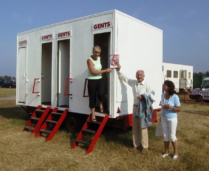 Dad laughing at Char using the 'Gents' at their day out at the circus!