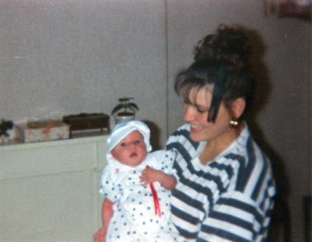 Serina with her baby daughter. 1990