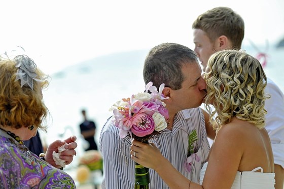Kissing me after our wedding ceremony
