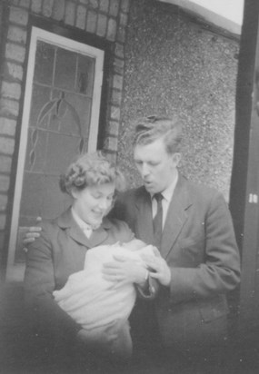 Home with baby Shirley, May 1957