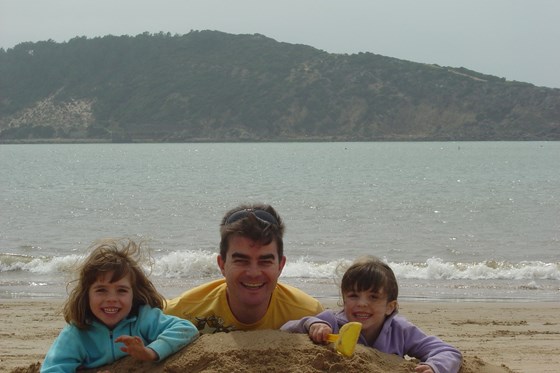 On the beach with his precious girls
