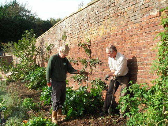 Ian reflecting on world events with a friend at Erlas Victorian Walled Garden back in 2009.