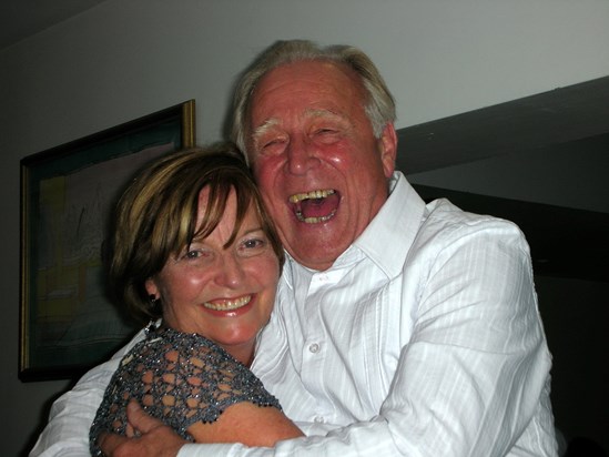 Hughie with his long time secretary Carole at his company retirement party.