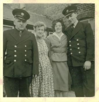 Dennis's mother and father and Elsie and Dennis in uniform.