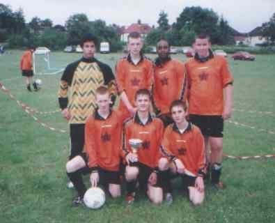 Michael winning a cup with Pits FC team