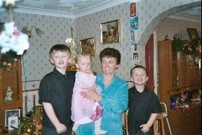 An old Christmas picture of Mum with her 3 older grandchildren Matthew, Daniel and Holly x