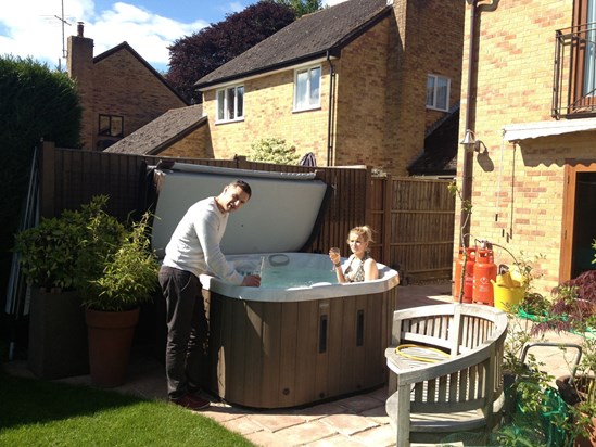 In the hot tub at Nat Nat and Grandad's house pictured with Uncle Brett