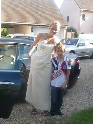 Looking stunning in her prom dress with brother Tom