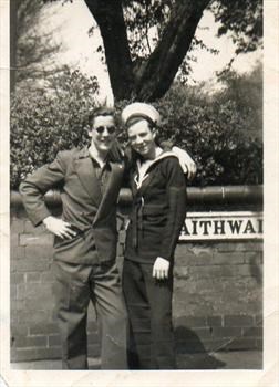 Dad in Navy suit with mate.