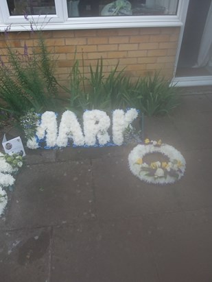 Mark floral tribute