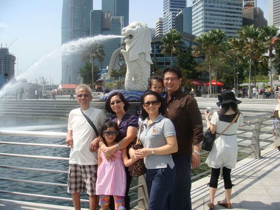 Daddy with family on one of his many trips to Singapore