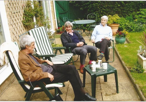 Derek, with Dad and Mum in the back garden at Sutton