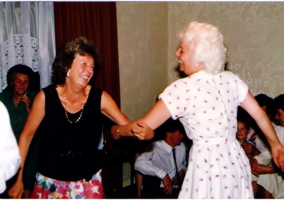 Joan enjoying a dance with her sister-in-law Maureen