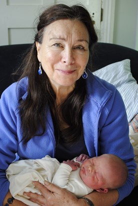 Holding her fifth grandchild Rufus for the first time