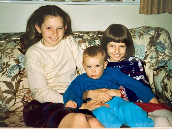 Nick with his big sisters. X