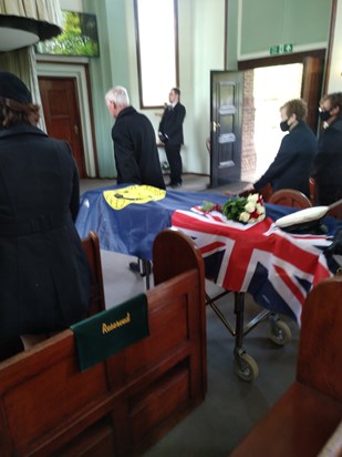 Bob's coffin covered with OWS ensign and his service commanders cap