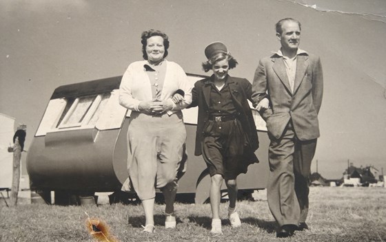 A young Joan with her parents