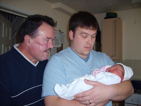 proud granddad meeting Darcee for the first time