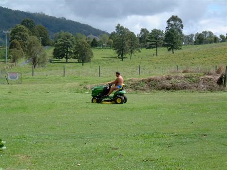 cutting the grass at Amos's farm,he loved it.