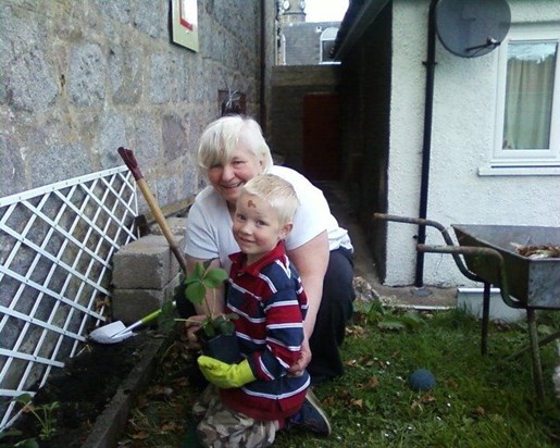 Mum and Mathew gardening