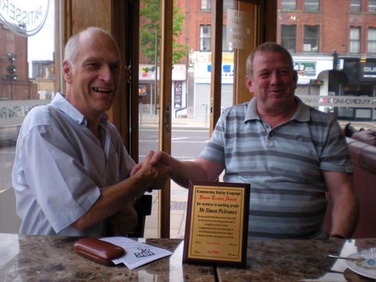 Simon receiving the Robert Tressell Award for services to working people