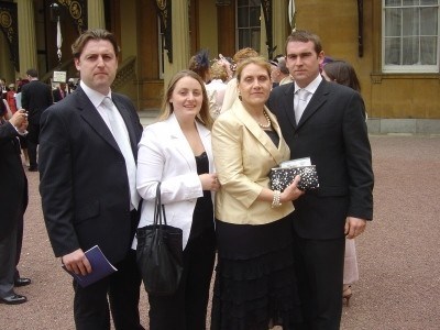 Jan collecting her MBE with her proud children x