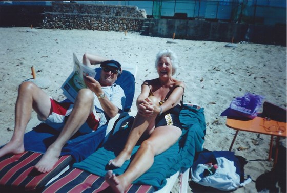 Beryl with Joe on a beach