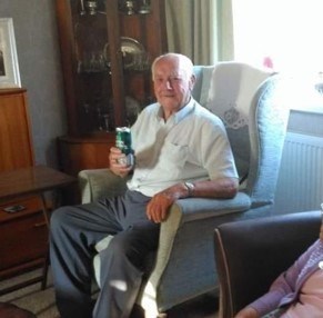 John relaxing with a beer at home