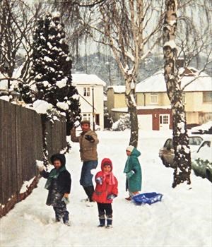 Mike and the kids playing in the snow