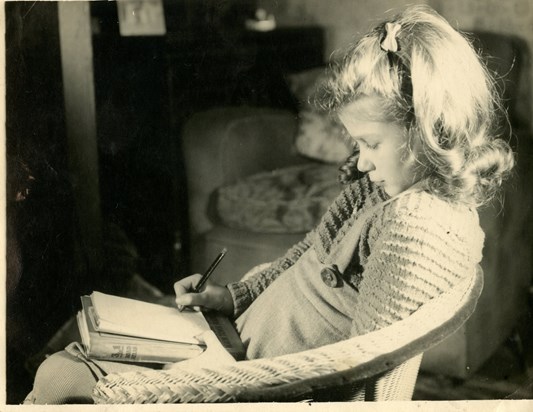 Sheila Oxtoby  writing a list in 1940