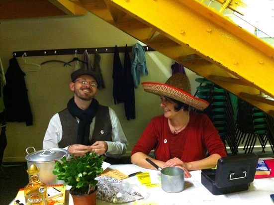 Suzanne on the stewarding the ticket desk at at Oxfolk Ceilidh, Dec 2013.  (There was a Mexican theme.)  JB