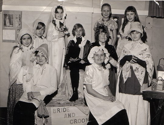 Suzanne (far left) attends a Victorian wedding, aged 11