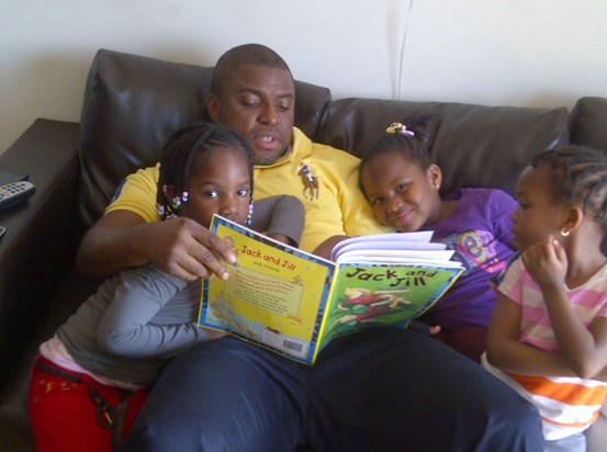 Ike reading to his girls - Summer 2011