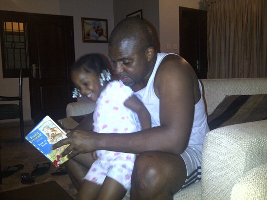 Zel enjoying story time with daddy