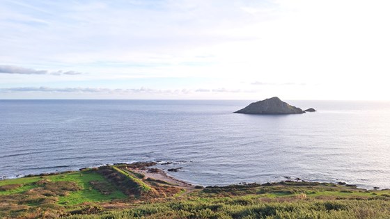 The Mewstone near Wembury, where the family use to regularly go to the beach, this picture was a watermark in the Order of Service