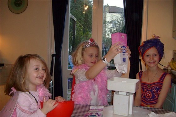 Baking a cake whilst wearing some crazy fancy dress - strange but true!