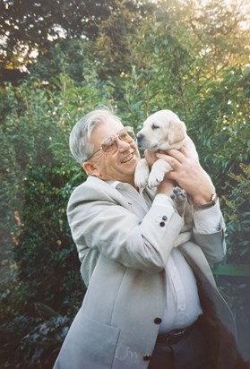 John with a guide dog puppy