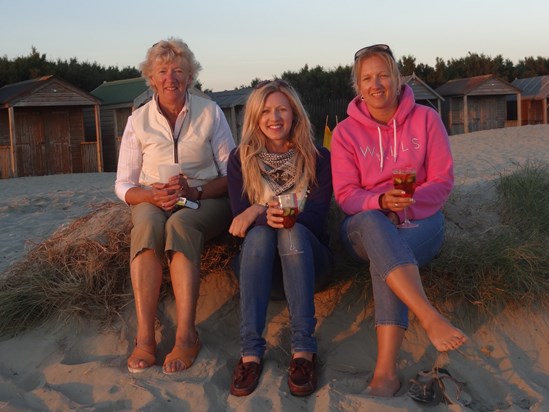 Picnic dinner at the beach with her girls