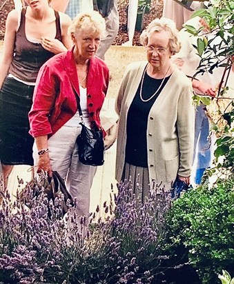 Alison and best friend, Georgina being spied on perusing a floral display 