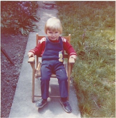 Mike, very young, sat in the garden at Beach Avenue, probably circa 1975