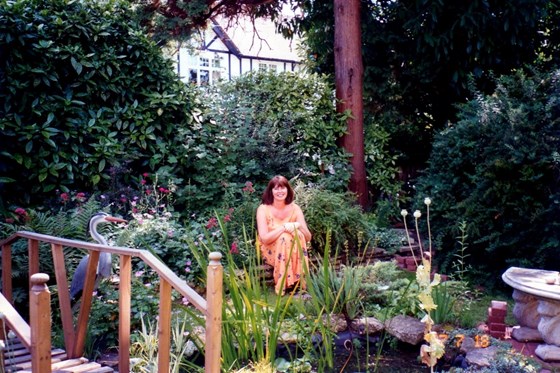 Carolyn in her beautiful Bowes Rd garden