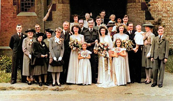 A young Maurice on extreme right with all his family at his sister Dorothy's wedding
